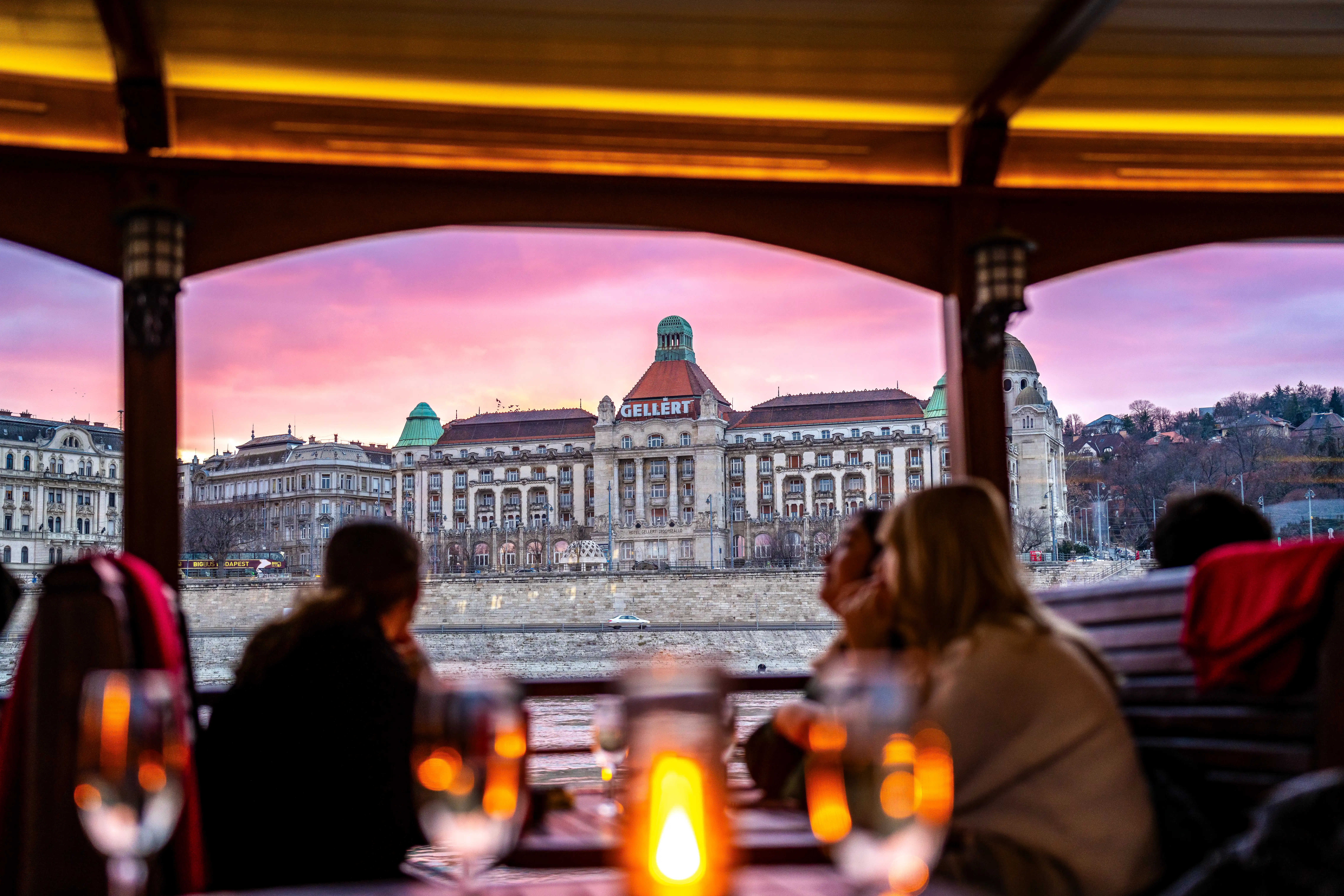Budapest Danube river cruise at night with the illuminated Hungarian Parliament building in the background