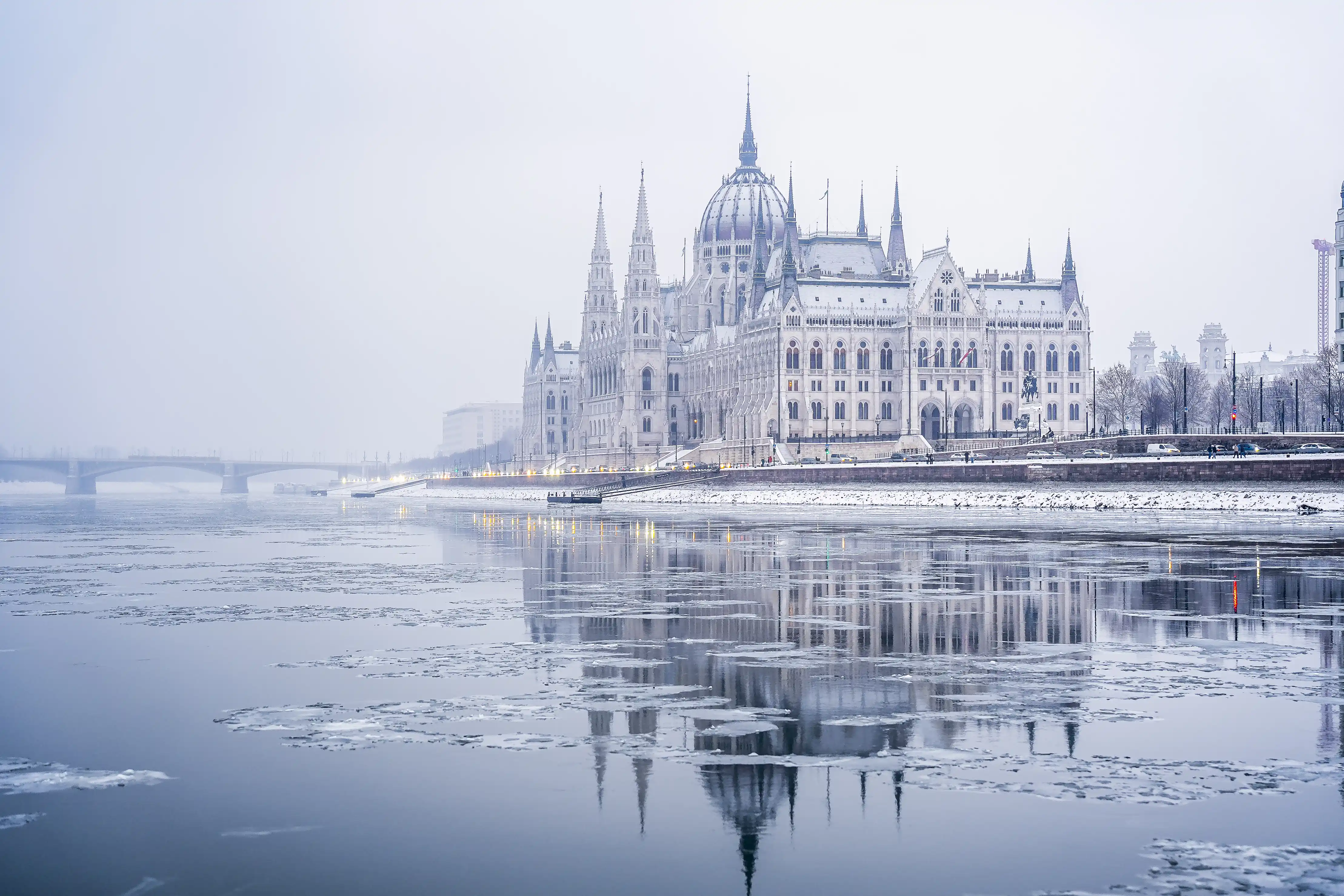 Budapest Danube river cruise at night with the illuminated Hungarian Parliament building in the background