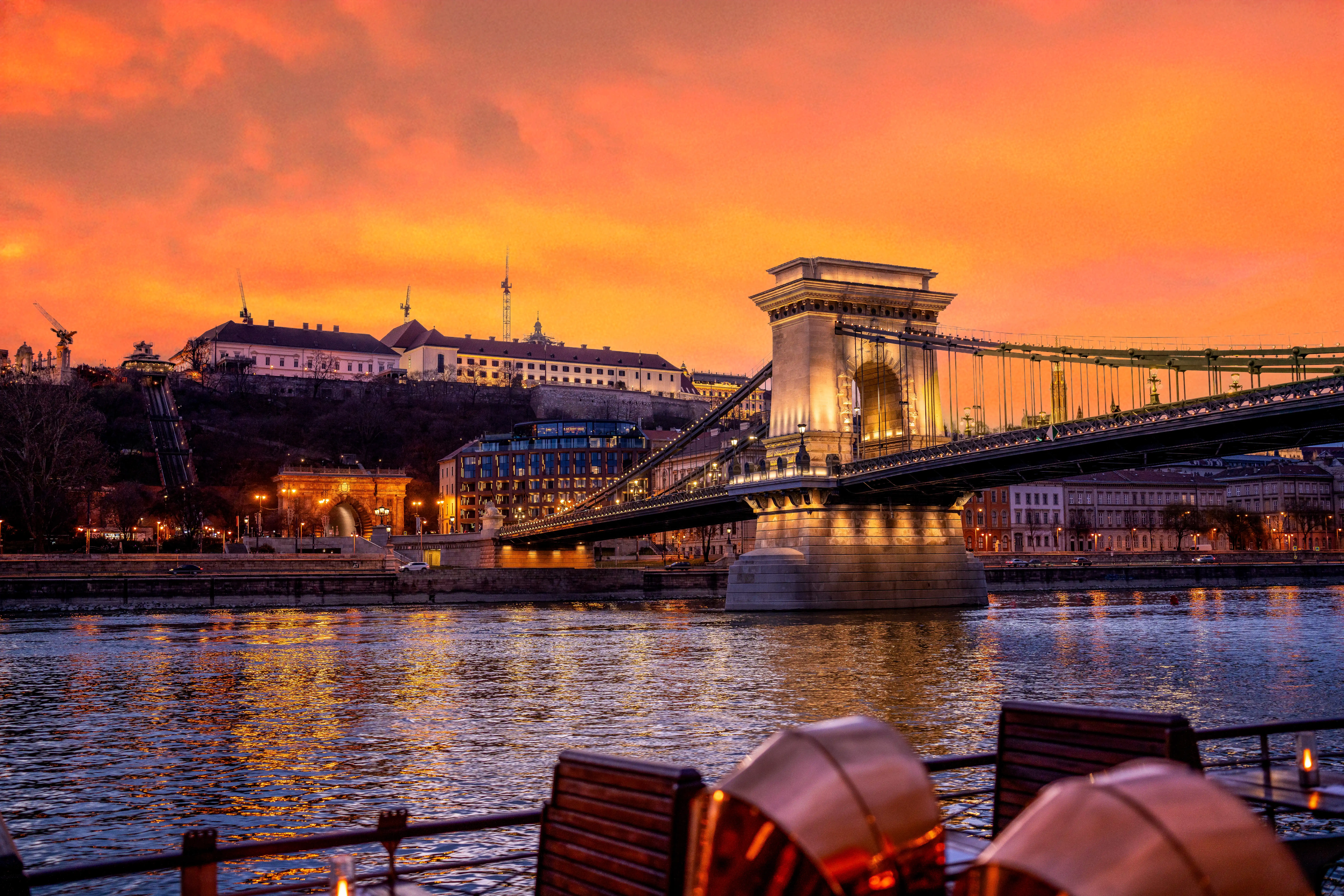 Budapest Danube river cruise at night with the illuminated Hungarian Parliament building in the background