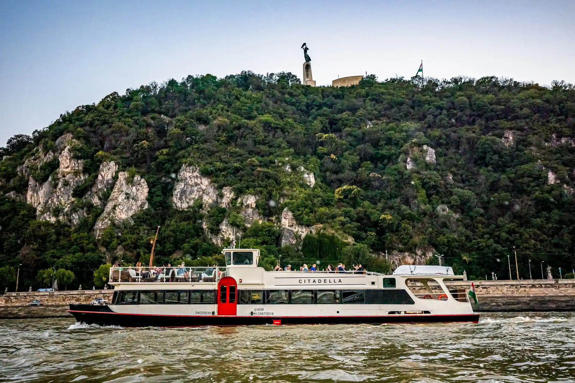 Budapest Danube river cruise at night with the illuminated Hungarian Parliament building in the background