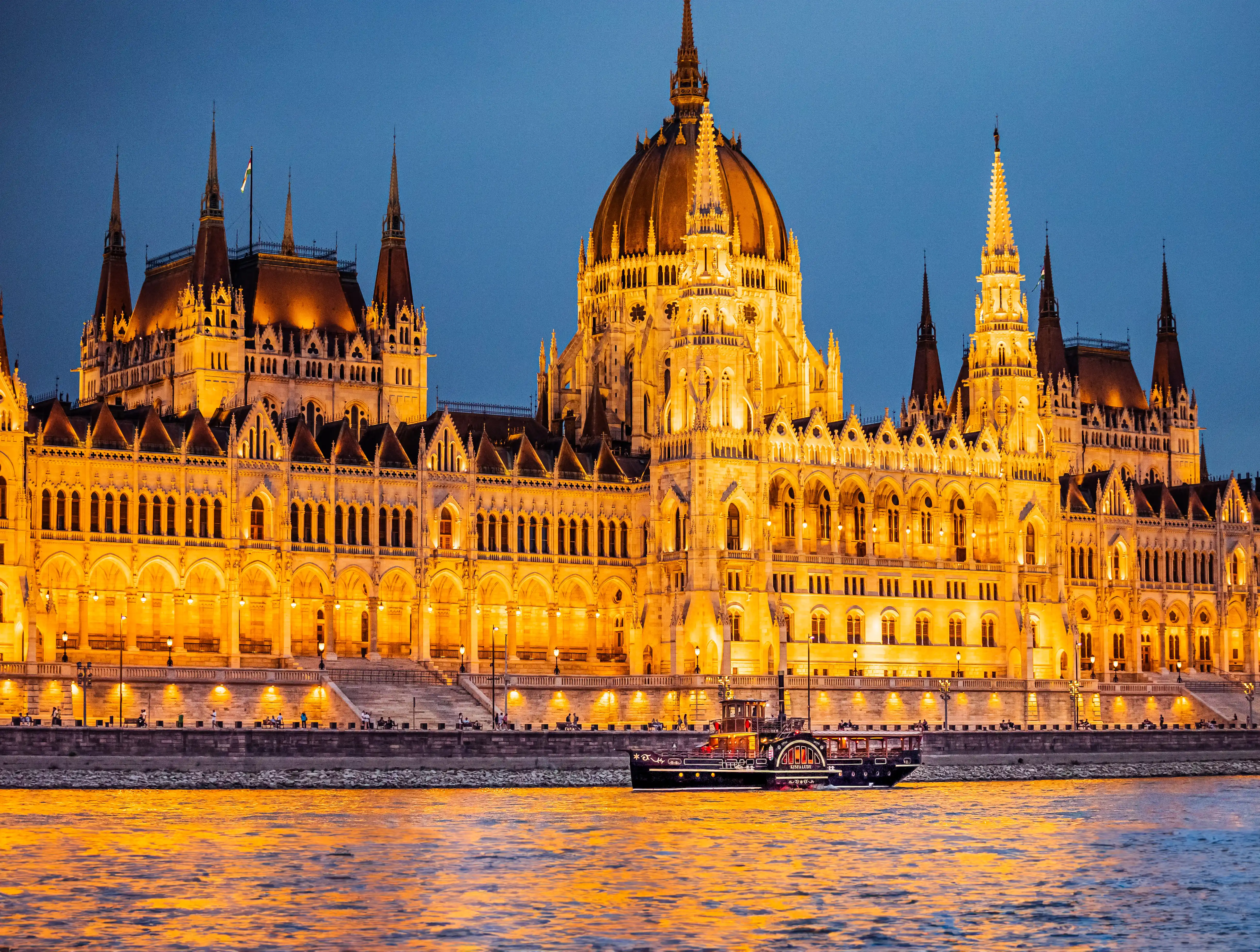 View of the illuminated Hungarian Parliament building from a Duna Cruises tour