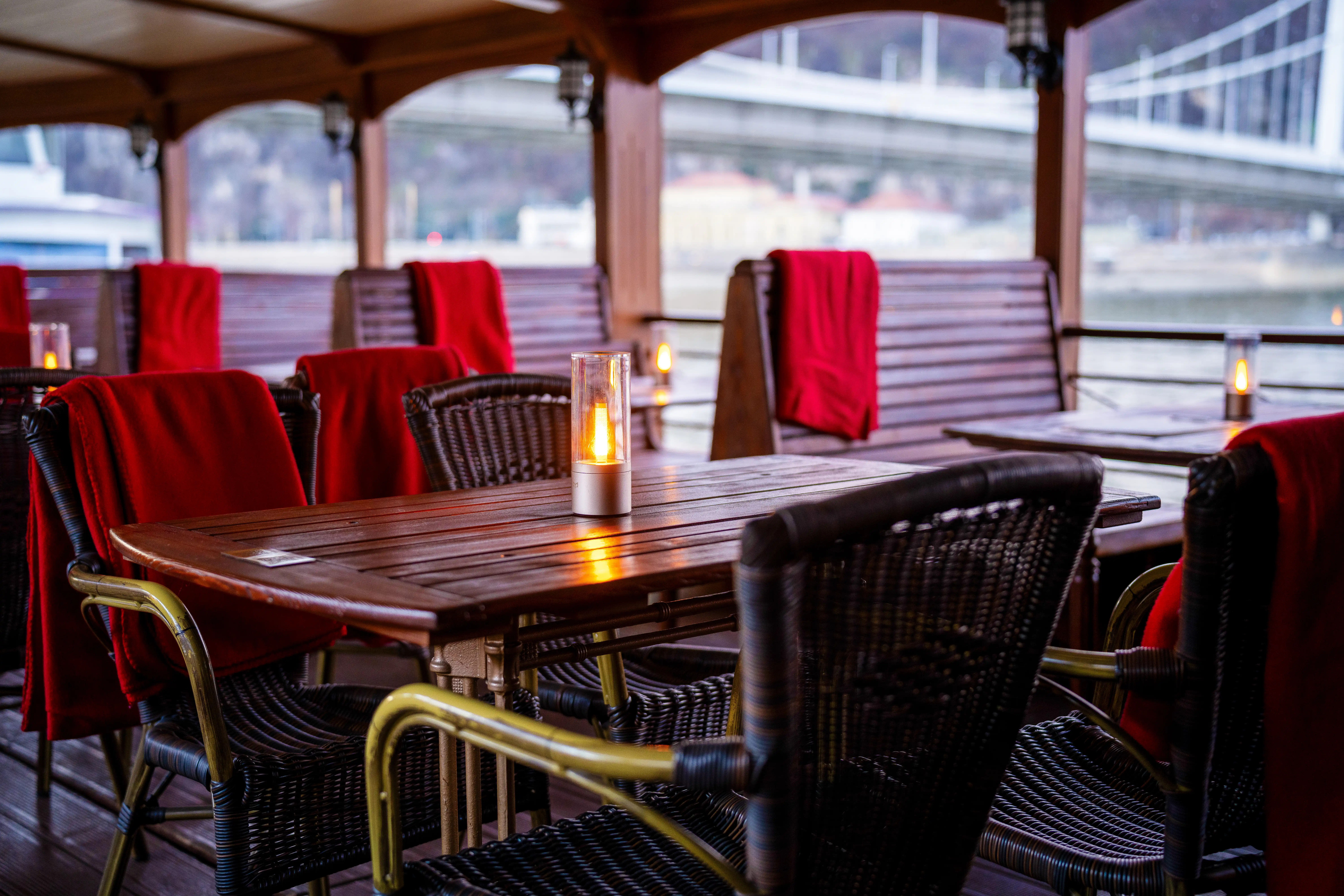 Indoor river cruise cabin with large panoramic windows and blankets for bad weather sightseeing
