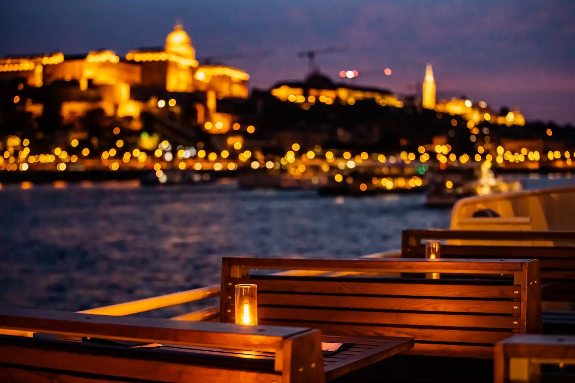 Capturing the stunning Danube scenery at night from the open deck of a premium river boat